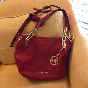 Trademark Michael Kors beautiful Christmas red handbag gold hardware.